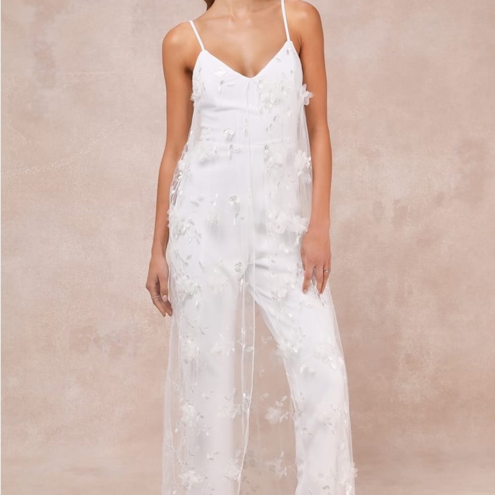 Extreme Elegance White Mesh Floral Embroidered Cape Jumpsuit
Lulus $79 Online